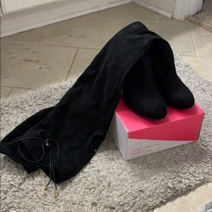 Tall black suede boots